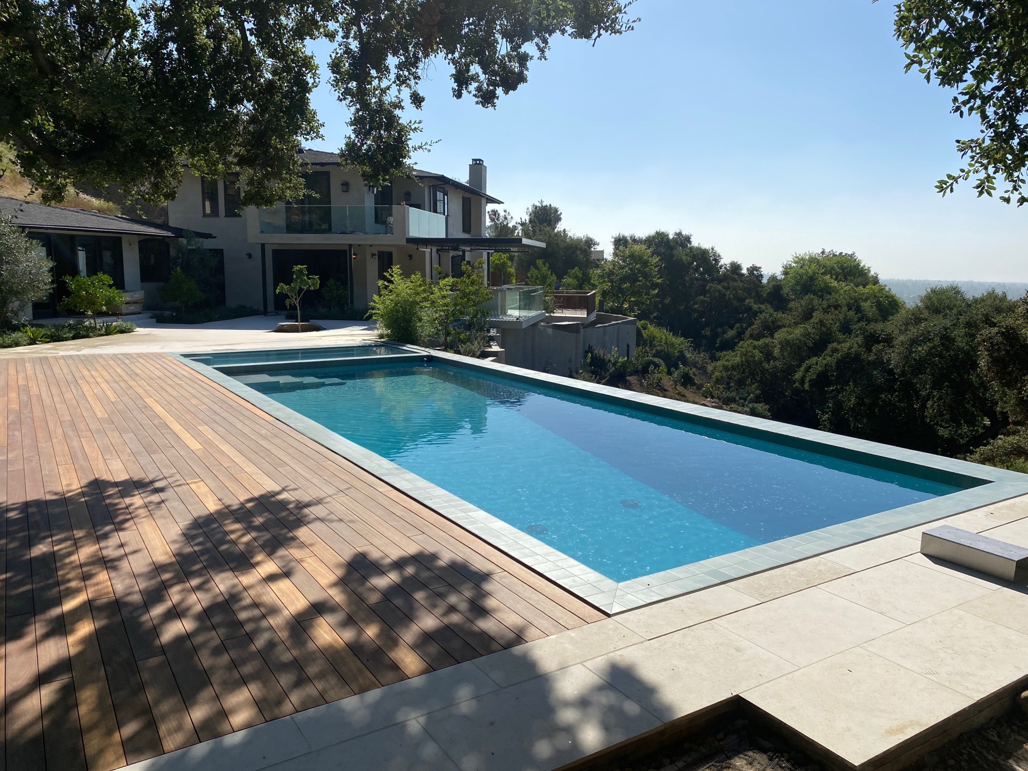 Luxury infinity pool with hardwood deck